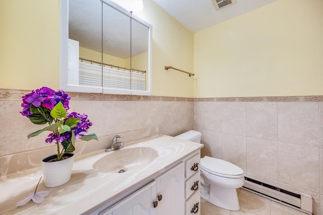33 Highview Dr Unit 33, Sandwich, MA 02563 - full bath with visible vents, vanity, wainscoting, toilet, and a baseboard radiator