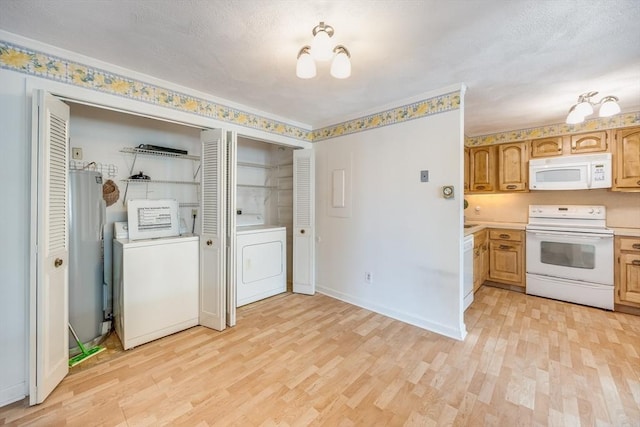 33 Highview Dr Unit 33, Sandwich, MA 02563 - washroom featuring washer / dryer, baseboards, laundry area, and light wood finished floors
