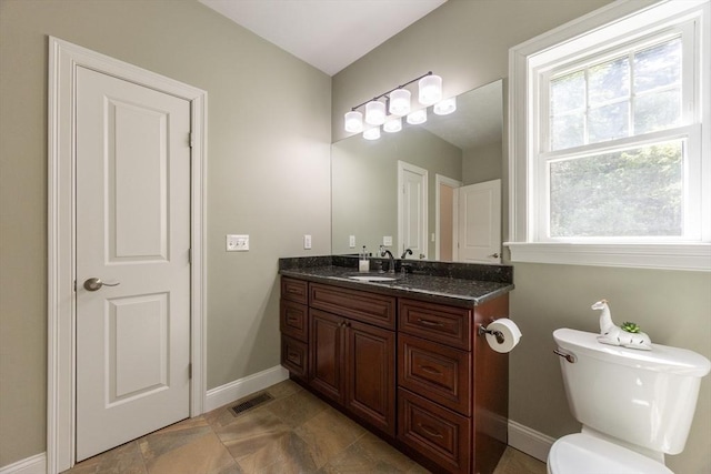 10 Chase Lndg Unit B, Easton, MA 02375 - bathroom with vanity, baseboards, toilet, and stone finish floors
