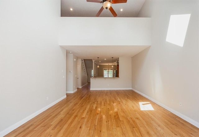 10 Chase Lndg Unit B, Easton, MA 02375 - unfurnished living room with light wood-style flooring, ceiling fan, baseboards, and recessed lighting