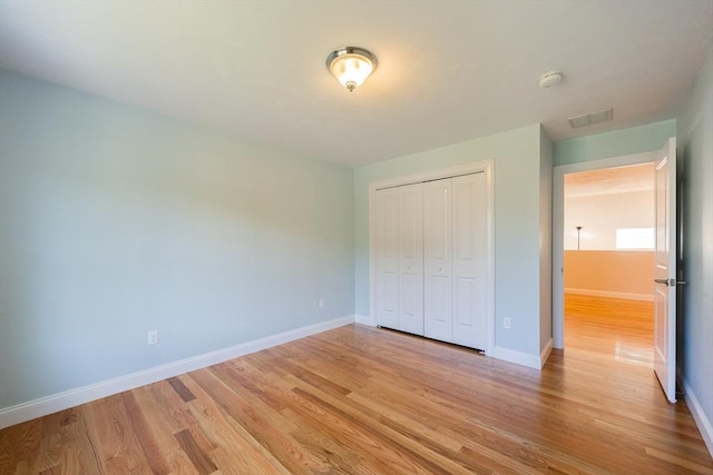 10 Chase Lndg Unit B, Easton, MA 02375 - unfurnished bedroom featuring light wood-style floors, baseboards, and a closet