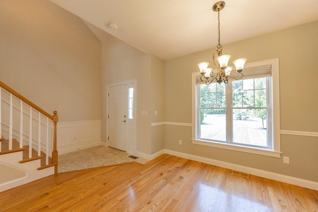 10 Chase Lndg Unit B, Easton, MA 02375 - foyer with wood finished floors, a chandelier, stairs, and lofted ceiling