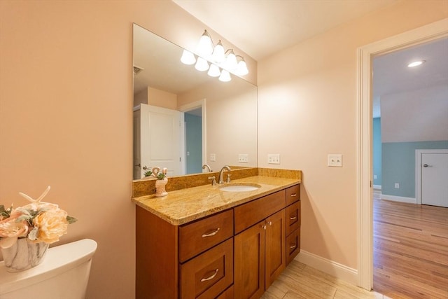 10 Chase Lndg Unit B, Easton, MA 02375 - bathroom featuring vanity, wood finished floors, toilet, and baseboards
