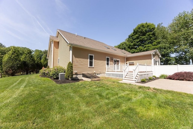 10 Chase Lndg Unit B, Easton, MA 02375 - back of property featuring a wooden deck and central AC