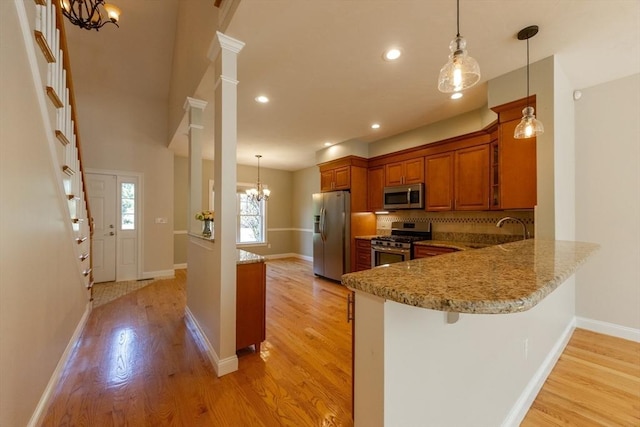 10 Chase Lndg Unit B, Easton, MA 02375 - kitchen with appliances with stainless steel finishes, a chandelier, brown cabinets, light wood-type flooring, and recessed lighting