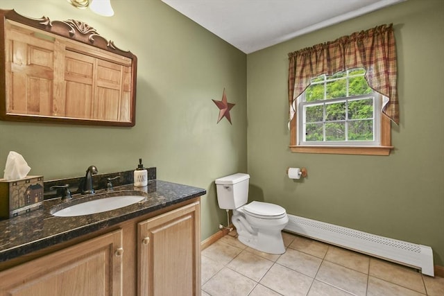 18 Jackson Ave, Rutland, MA 01543 - bathroom with a baseboard radiator, baseboards, vanity, tile patterned flooring, and toilet