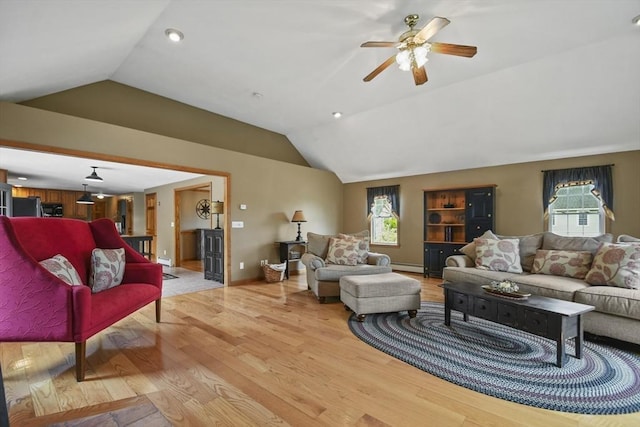 18 Jackson Ave, Rutland, MA 01543 - living area with vaulted ceiling, a ceiling fan, light wood-style floors, baseboard heating, and baseboards