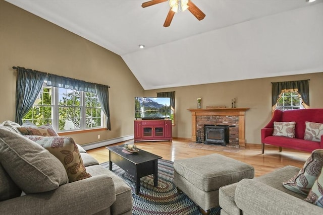 18 Jackson Ave, Rutland, MA 01543 - living area with a baseboard heating unit, healthy amount of natural light, lofted ceiling, a ceiling fan, and wood finished floors