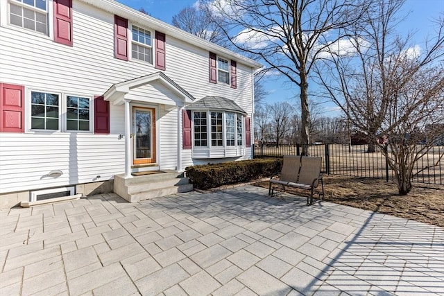 view of patio featuring fence