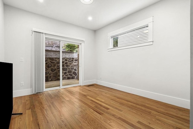 50 Cottage St Unit 1, Chelsea, MA 02150 - empty room featuring baseboards, wood finished floors, and recessed lighting