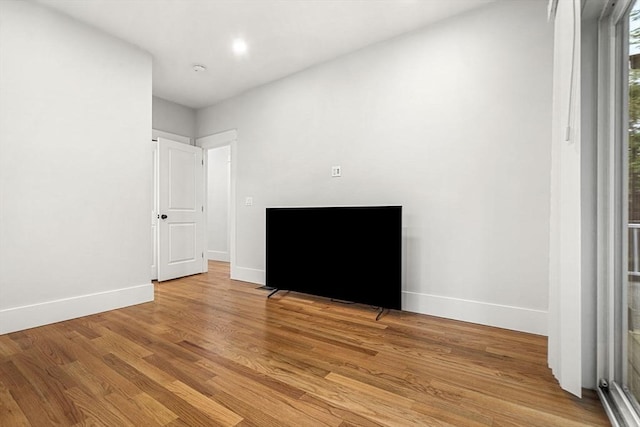 50 Cottage St Unit 1, Chelsea, MA 02150 - unfurnished bedroom featuring baseboards and light wood-style flooring