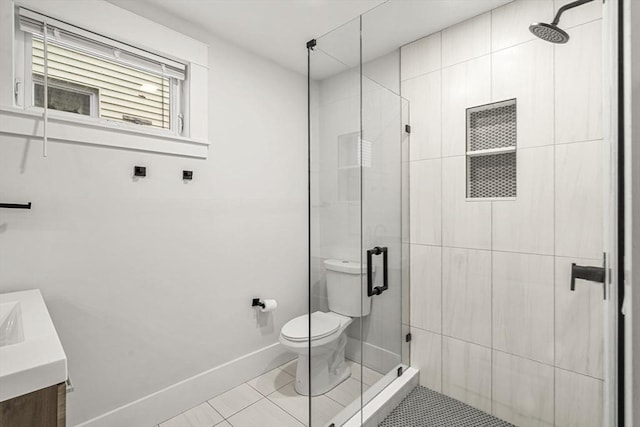 50 Cottage St Unit 1, Chelsea, MA 02150 - bathroom featuring toilet, a shower stall, vanity, baseboards, and tile patterned flooring