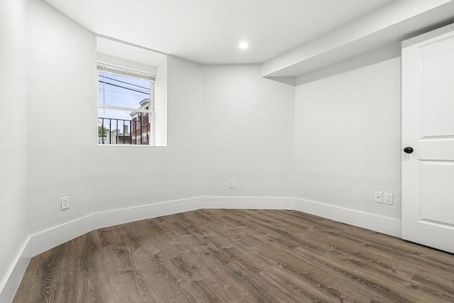 50 Cottage St Unit 1, Chelsea, MA 02150 - below grade area with wood finished floors and baseboards