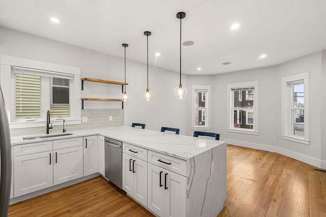 50 Cottage St Unit 1, Chelsea, MA 02150 - kitchen featuring dishwasher, a sink, a peninsula, light wood-style flooring, and recessed lighting