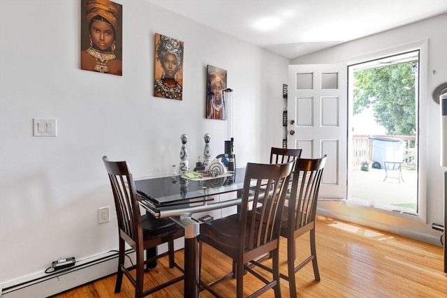 dining room featuring light wood-style flooring and a baseboard radiator