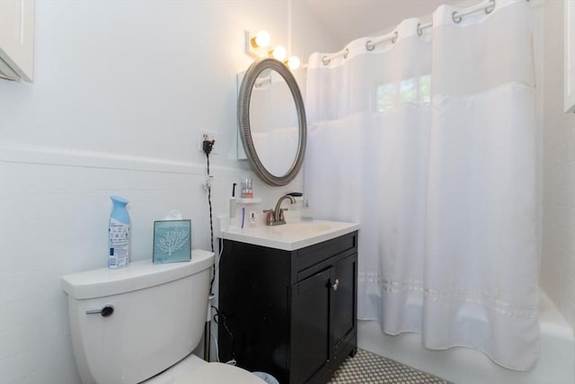 bathroom featuring vanity, toilet, and shower / tub combo with curtain