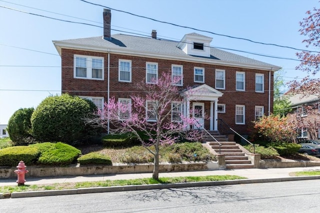 view of property with brick siding