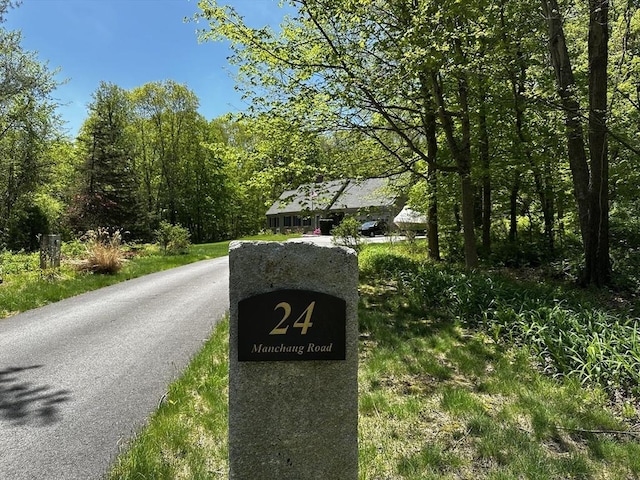 view of road featuring a wooded view
