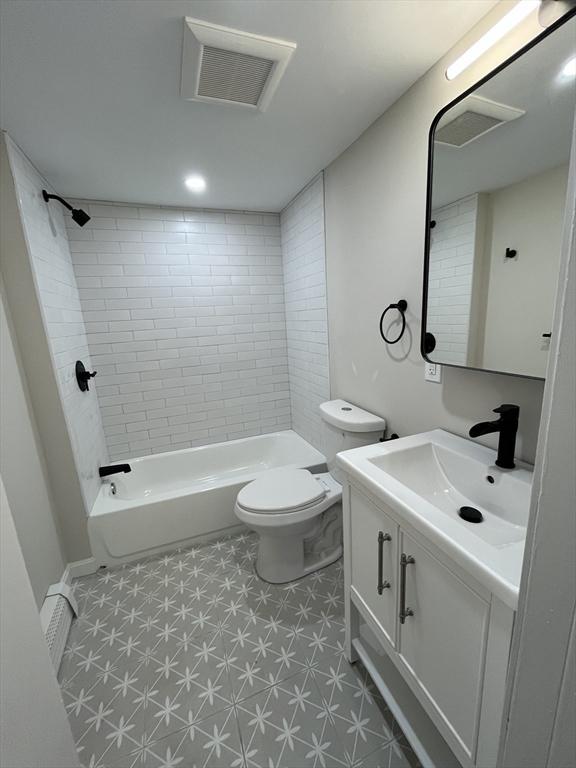 561-A E 6th St, Boston, MA 02127 - bathroom featuring tile patterned floors, vanity, and tub / shower combination