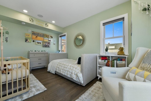 bedroom featuring dark hardwood / wood-style flooring