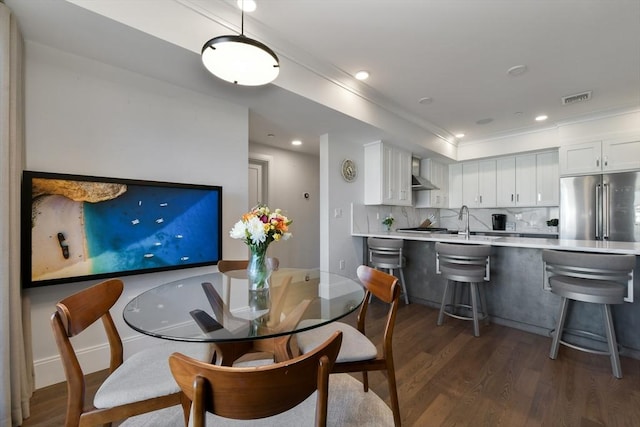 dining room with dark hardwood / wood-style flooring