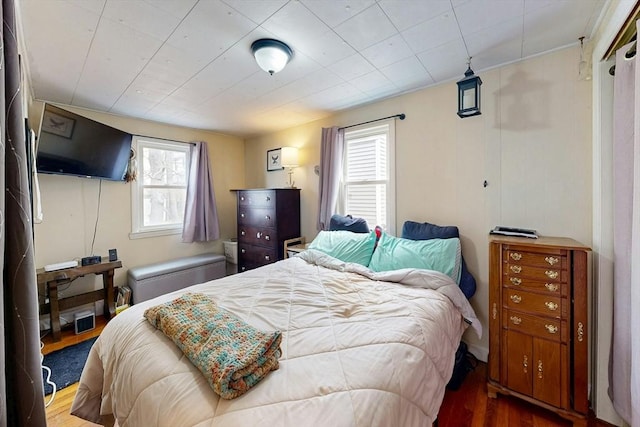 bedroom with wood finished floors