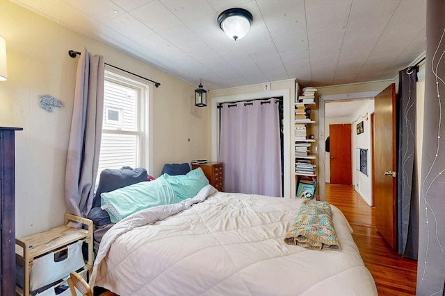 bedroom with wood finished floors