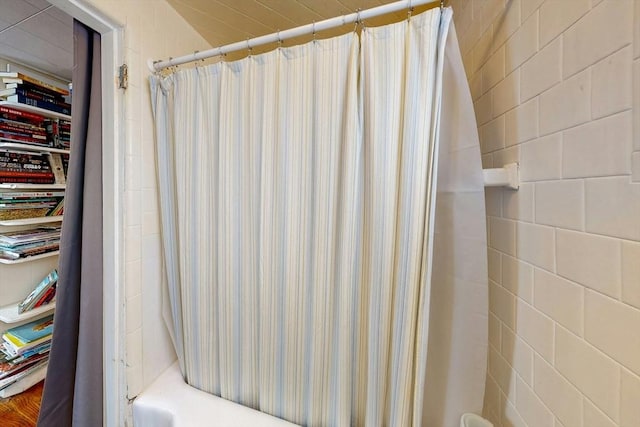 bathroom featuring shower / bath combination with curtain