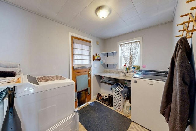 washroom featuring laundry area and separate washer and dryer