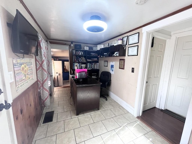 tiled home office featuring ornamental molding