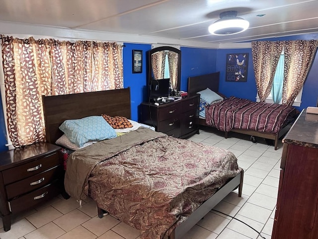 bedroom with light tile patterned floors and ceiling fan