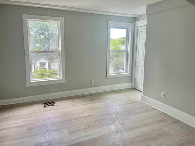 43 Aubin St Unit 1, Amesbury, MA 01913 - spare room with healthy amount of natural light, baseboards, and light wood finished floors