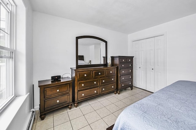 312 Water St Unit 1, Lawrence, MA 01841 - bedroom featuring light tile patterned flooring, a closet, and baseboard heating