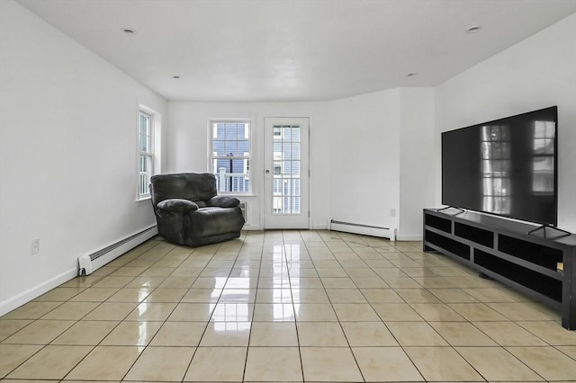 312 Water St Unit 1, Lawrence, MA 01841 - living room with baseboard heating, light tile patterned floors, and baseboards