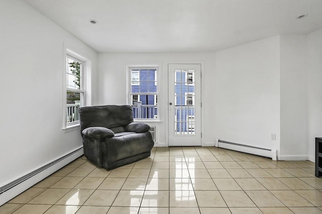312 Water St Unit 1, Lawrence, MA 01841 - sitting room with a baseboard heating unit, light tile patterned floors, and baseboards
