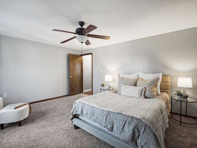 bedroom with a ceiling fan, carpet, and baseboards