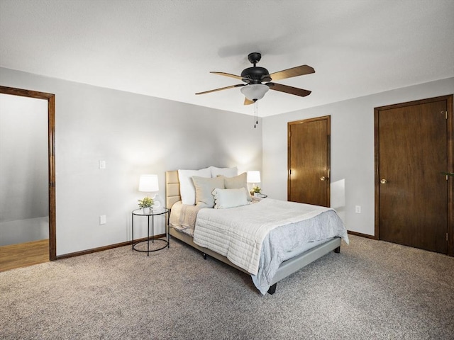 bedroom with carpet, baseboards, and ceiling fan