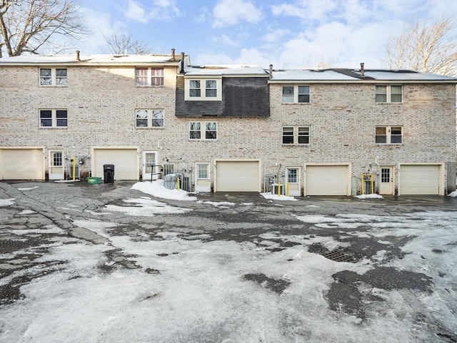 exterior space featuring brick siding