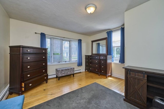15 Hamilton St, Boston, MA 02136 - bedroom with wood-type flooring, baseboard heating, and a baseboard radiator