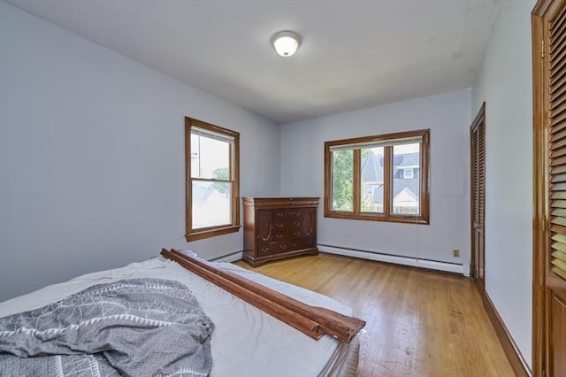 15 Hamilton St, Boston, MA 02136 - bedroom with a baseboard radiator, wood finished floors, and a baseboard heating unit