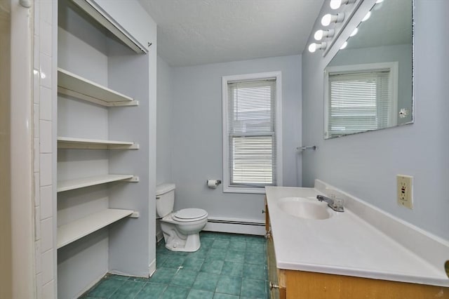 15 Hamilton St, Boston, MA 02136 - bathroom featuring baseboard heating, vanity, a textured ceiling, and tile patterned floors