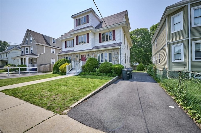 15 Hamilton St, Boston, MA 02136 - view of front facade with stone siding and a residential view