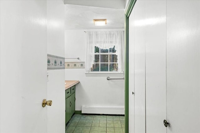 bathroom with vanity and a baseboard radiator