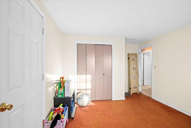 unfurnished bedroom with carpet flooring and a closet