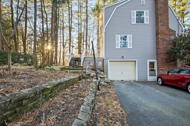 view of property exterior featuring a garage