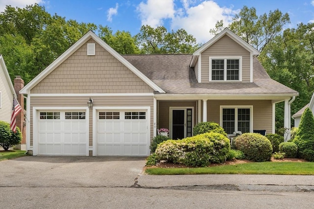 89 Cortland Dr Unit 89, North Andover, MA 01845 - view of front of house featuring an attached garage, asphalt driveway, and roof with shingles
