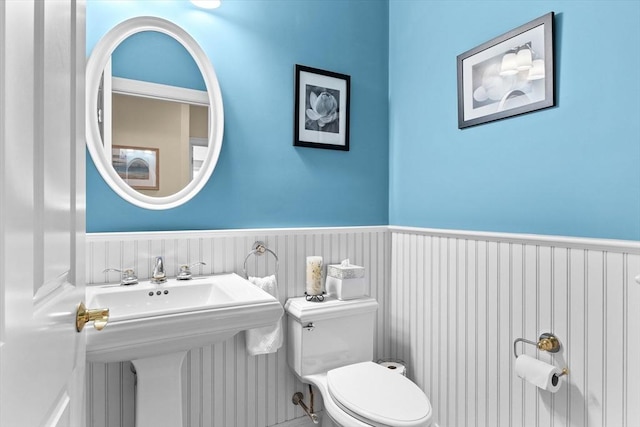 89 Cortland Dr Unit 89, North Andover, MA 01845 - half bath featuring toilet, a wainscoted wall, and a sink