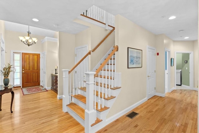 89 Cortland Dr Unit 89, North Andover, MA 01845 - foyer featuring light wood finished floors, a chandelier, stairs, and recessed lighting