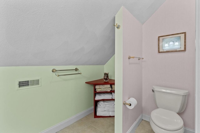 89 Cortland Dr Unit 89, North Andover, MA 01845 - bathroom featuring lofted ceiling, baseboards, toilet, tile patterned flooring, and a textured ceiling