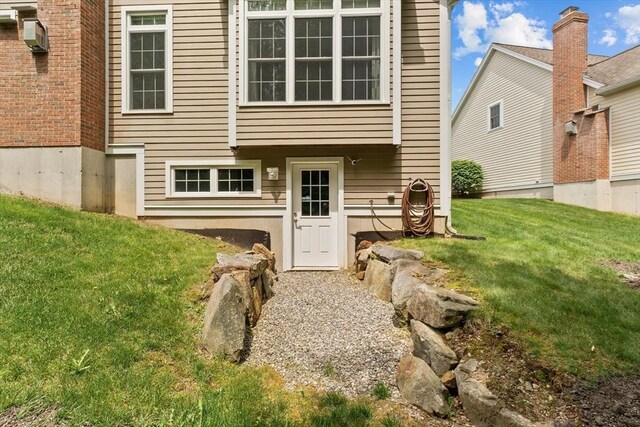 89 Cortland Dr Unit 89, North Andover, MA 01845 - rear view of house with a lawn